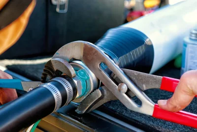 Technician tightening an industrial pipe connection in Miami