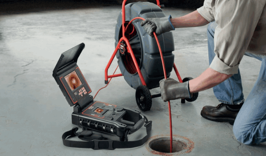 Technician performing a sewer camera inspection in Miami
